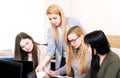 Lesson teacher school table computer business team workspace class mate group woman man room Royalty Free Stock Photo