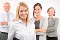 Business team young woman with mature colleagues Royalty Free Stock Photo