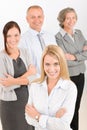 Business team young woman with mature colleagues Royalty Free Stock Photo