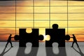 Business teamwork concept, two businessman are assembling the puzzle pieces Royalty Free Stock Photo