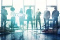 Business teamwork at the office. Workers join puzzle pieces on the desk. Partnership concept with light effects Royalty Free Stock Photo