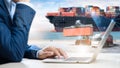 Business and Technology Digital of Cargo Containers Logistics Transport Concept, Business man using Tablet and Freight Ship Royalty Free Stock Photo