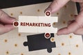 Business, Technology, Internet and network concept. Young businessman shows the word: Remarketing