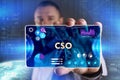 Business, Technology, Internet and network concept. Young businessman showing a word in a virtual tablet of the future: CSO