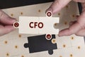 Business, Technology, Internet and network concept. Young businessman shows the word: CFO