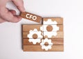 Business, Technology, Internet and network concept. Young businessman shows the word: CFO