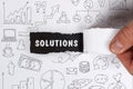 Business, Technology, Internet and network concept. Young businessman shows the word: Solutions