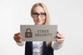 Business, Technology, Internet and network concept. Young girl holding a sign with an inscription cyber security Royalty Free Stock Photo