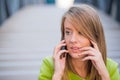 Business, technology and people concept - serious businesswoman with smartphone talking over office building Royalty Free Stock Photo