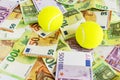 Business tennis background. Tennis Balls and Cash Euro Banknotes. Sports investment, prize money and betting concept