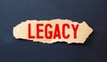 Business text LEGACY on torn paper, concept Royalty Free Stock Photo