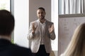 Business trainer makes speech during professional training in office Royalty Free Stock Photo