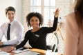 Business training African student girl asking question to speaker Royalty Free Stock Photo