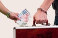 Business transfer deal. handover of a suitcase for money Royalty Free Stock Photo