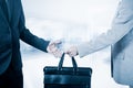 Business transfer. handover of a suitcase partners Royalty Free Stock Photo