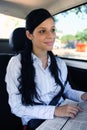 Business travel: businesswoman reading newspaper Royalty Free Stock Photo