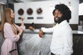 Business trip concept. Black man and caucasian woman businesspeople colleagues checking-in in hotel Royalty Free Stock Photo