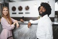 Business trip concept. Black man and caucasian woman businesspeople colleagues checking-in in hotel Royalty Free Stock Photo