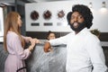 Business trip concept. Black man and caucasian woman businesspeople colleagues checking-in in hotel Royalty Free Stock Photo