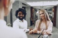 Business trip concept. Black man and caucasian woman businesspeople colleagues checking-in in hotel Royalty Free Stock Photo