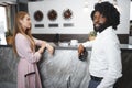 Business trip concept. Black man and caucasian woman businesspeople colleagues checking-in in hotel Royalty Free Stock Photo