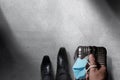 Business Trip in Coronavirus Situation Concept. Top View of Traveler Businessman Walking in Airport with Luggage and Surgical Mask Royalty Free Stock Photo