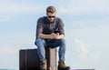 Business trip. Handsome guy traveler. Guy outdoors with vintage suitcase. Luggage concept. Calling taxi. Travel agency Royalty Free Stock Photo