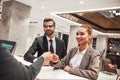 Couple on a business trip doing check-in at the hotel Royalty Free Stock Photo