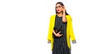 Business wear look style. Beauty fashion model girl in trendy yellow blazer wearing glasses, on white background Royalty Free Stock Photo