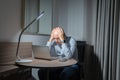 Business white senior, caucasian freelance man person working late from home at night, thinking about problem with computer Royalty Free Stock Photo