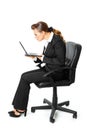 Business woman amazedly looks in laptops screen Royalty Free Stock Photo