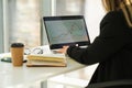 Business woman analyzes financial.company charts sitting at a laptop in the office. Royalty Free Stock Photo