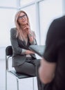 Business woman answering questions during an interview. Royalty Free Stock Photo