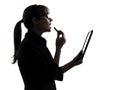 Business woman applying lipstick computer computing digital tab Royalty Free Stock Photo