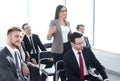 business woman asks a question standing in the conference room Royalty Free Stock Photo