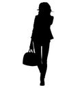 Business woman, attractive confident woman. Fashionably dressed in jacquard, jersey blazer and women`s skinny jeans.