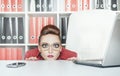 Business woman with big eyes hiding behind table Royalty Free Stock Photo