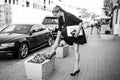 Business woman in black dress in the city with documents Royalty Free Stock Photo