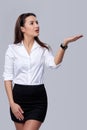 Business woman blowing on palm Royalty Free Stock Photo