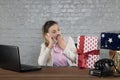 Business woman boasts of the amount of gifts on the phone