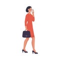 A business woman with a briefcase is talking on the phone and walking down the street Royalty Free Stock Photo