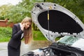 Business woman with a broken car Royalty Free Stock Photo