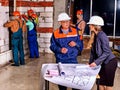 Business woman in builder helmet