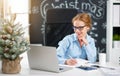 Businesswoman freelancer working at a computer at Christmas Royalty Free Stock Photo