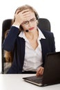 Business woman at call center is having headache. Royalty Free Stock Photo