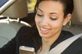 Business woman in a car looking at the camera. Royalty Free Stock Photo