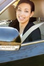 Business woman in a car looking at the camera. Royalty Free Stock Photo