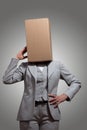 Business woman with a cardboard box head Royalty Free Stock Photo