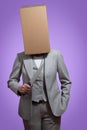 Business woman with a cardboard box head holding a knife Royalty Free Stock Photo