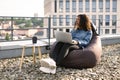 Business woman in casual denim shirt working on laptop. Royalty Free Stock Photo